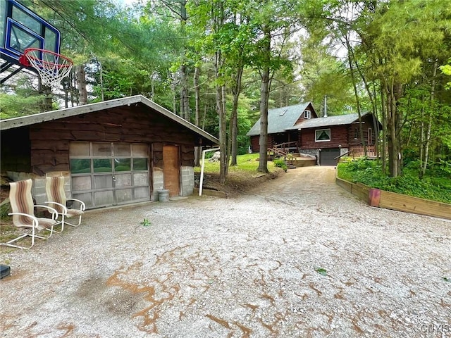 13 Popple Hill Rd, Fowler, NY 13642 - view of front of home featuring a detached garage, driveway, an outdoor structure, and view of scattered trees