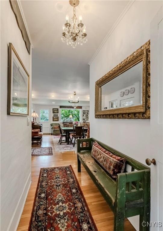 2761 State Route 12b, Marshall, NY 13328 - hallway featuring a chandelier, light wood-type flooring, and crown molding