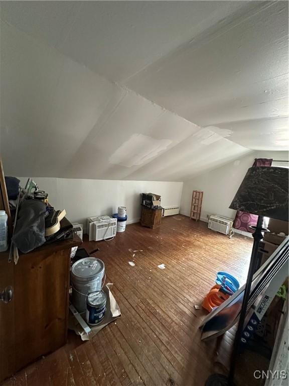 14309 Pearl St, Diana, NY 13648 - additional living space featuring wood-type flooring, vaulted ceiling, and a baseboard heating unit