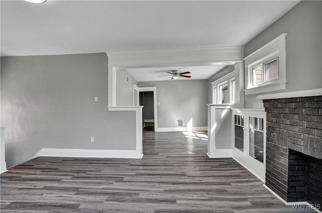 110 Weyand Ave, Buffalo, NY 14210 - unfurnished living room featuring a fireplace, a ceiling fan, and wood finished floors