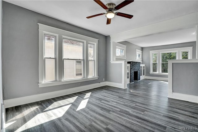 110 Weyand Ave, Buffalo, NY 14210 - unfurnished living room with dark wood-style flooring, a ceiling fan, and a fireplace