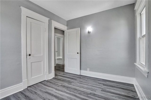 110 Weyand Ave, Buffalo, NY 14210 - unfurnished bedroom featuring wood finished floors and baseboards