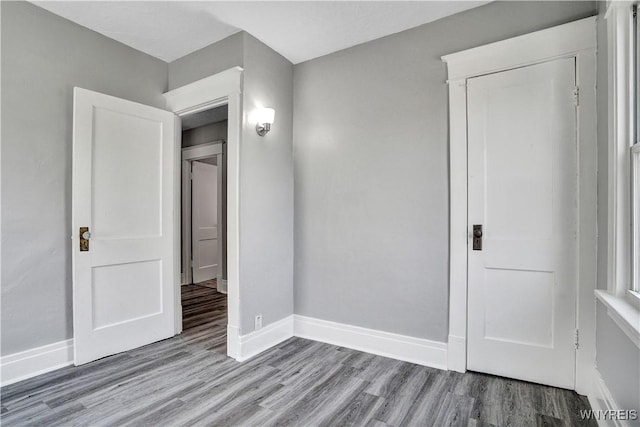 110 Weyand Ave, Buffalo, NY 14210 - unfurnished bedroom with wood finished floors and baseboards