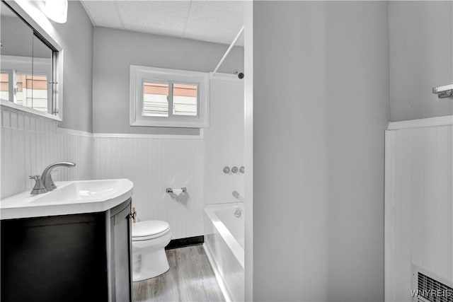 110 Weyand Ave, Buffalo, NY 14210 - bathroom featuring wainscoting, vanity, wood finished floors, shower / bath combination, and plenty of natural light