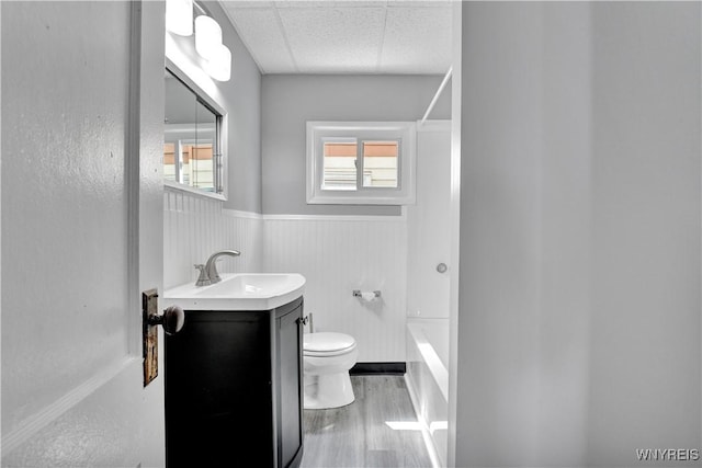 110 Weyand Ave, Buffalo, NY 14210 - bathroom with a wainscoted wall, vanity, wood finished floors, and washtub / shower combination