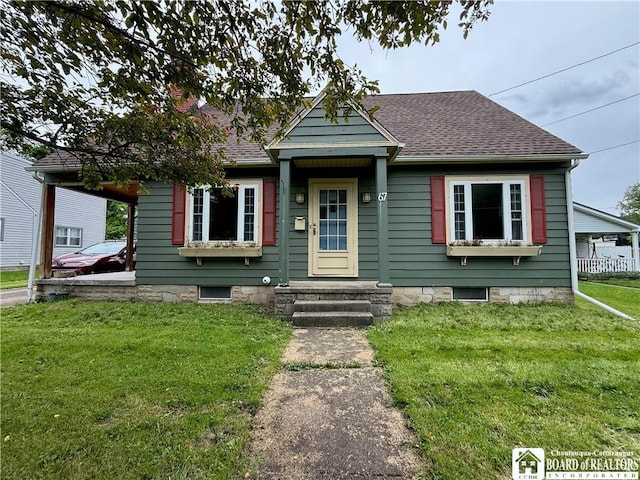 67 Harriet St, Allegany, NY 14706 - bungalow featuring a front yard, a shingled roof, and a chimney
