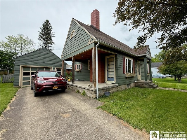 67 Harriet St, Allegany, NY 14706 - view of front of property with a porch, a front yard, a chimney, roof with shingles, and a garage