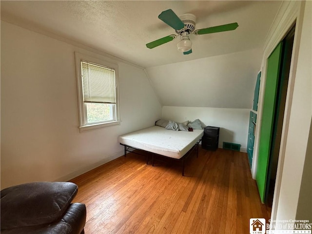 67 Harriet St, Allegany, NY 14706 - bedroom featuring hardwood / wood-style floors, vaulted ceiling, and ceiling fan