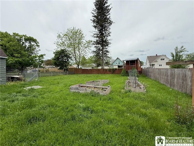 67 Harriet St, Allegany, NY 14706 - fenced backyard featuring a garden