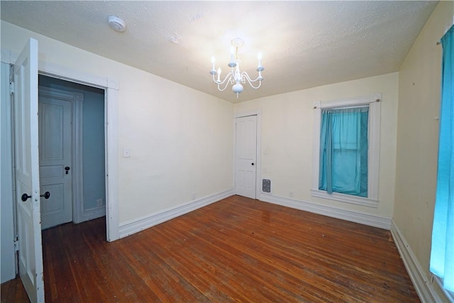 362 Euclid Ave, Elmira-City, NY 14905 - empty room featuring a chandelier, wood-type flooring, and a smoke detector