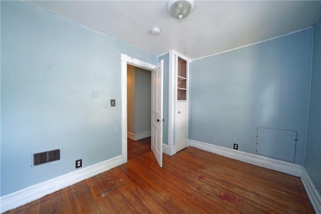 362 Euclid Ave, Elmira-City, NY 14905 - empty room with a smoke detector and hardwood / wood-style floors