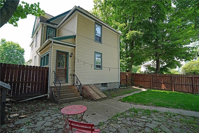 362 Euclid Ave, Elmira-City, NY 14905 - back of house with a fenced backyard and entry steps