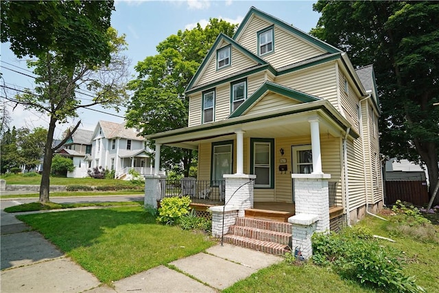 362 Euclid Ave, Elmira-City, NY 14905 - traditional style home with a porch and a front lawn