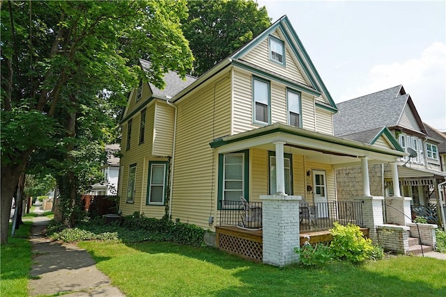 362 Euclid Ave, Elmira-City, NY 14905 - view of front of house featuring covered porch, a front lawn, and roof with shingles