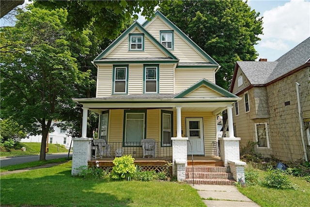362 Euclid Ave, Elmira-City, NY 14905 - view of front of house with covered porch and a front lawn