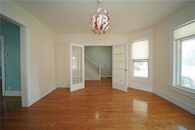 362 Euclid Ave, Elmira-City, NY 14905 - unfurnished dining area featuring wood finished floors and french doors