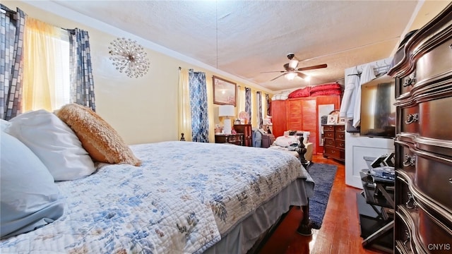 900 Sherman Pl, Utica, NY 13502 - bedroom with wood finished floors and a textured ceiling