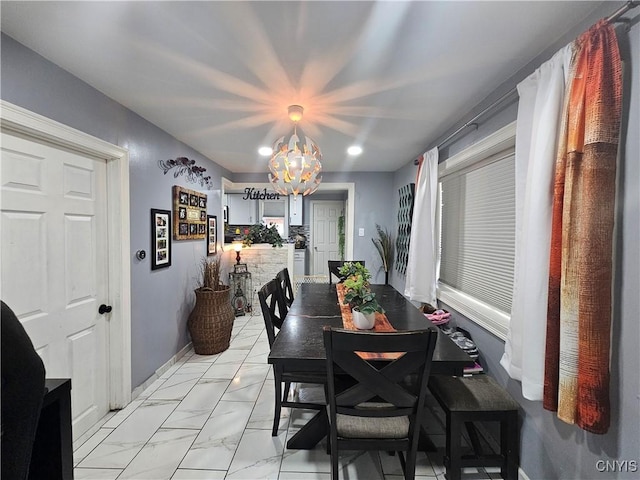 6 Bryant St, Utica, NY 13502 - dining area with a chandelier and light marble finish floors