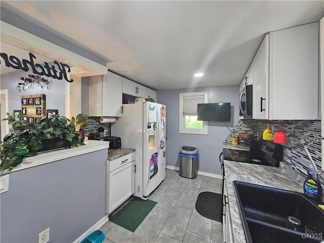 6 Bryant St, Utica, NY 13502 - kitchen featuring white refrigerator with ice dispenser, stainless steel microwave, decorative backsplash, white cabinets, and light tile patterned floors