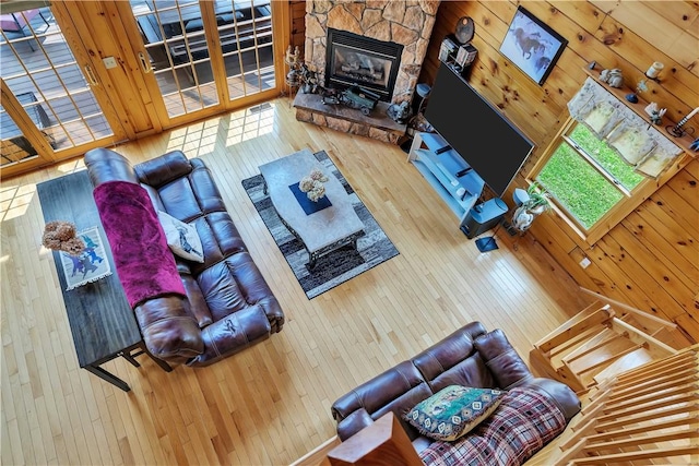 5600 State Route 81, Greenville, NY 12083 - living room featuring wood-type flooring, a fireplace, and wood walls