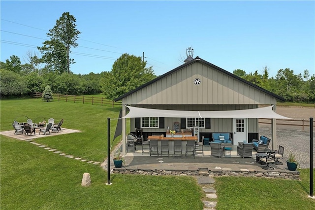 5600 State Route 81, Greenville, NY 12083 - back of house with an outdoor living space with a fire pit, a patio area, and board and batten siding