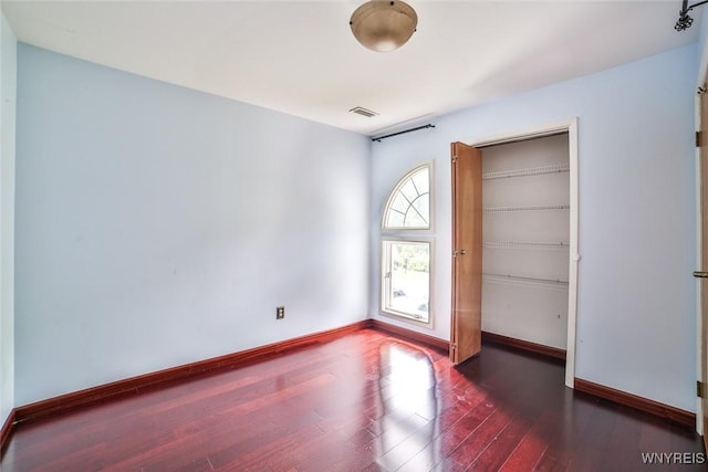 1185 Youngs Rd Unit F, Amherst, NY 14221 - spare room with wood finished floors and baseboards