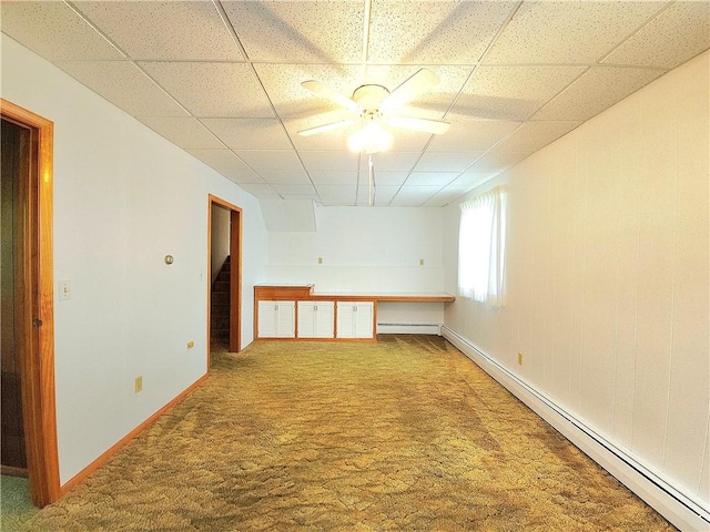 4883 Pinecrest Rd, Veteran, NY 14864 - carpeted empty room with a baseboard heating unit, a paneled ceiling, and ceiling fan