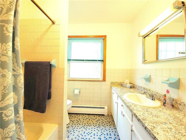 4883 Pinecrest Rd, Veteran, NY 14864 - full bathroom with baseboard heating, vanity, tile walls, wainscoting, and tile patterned floors