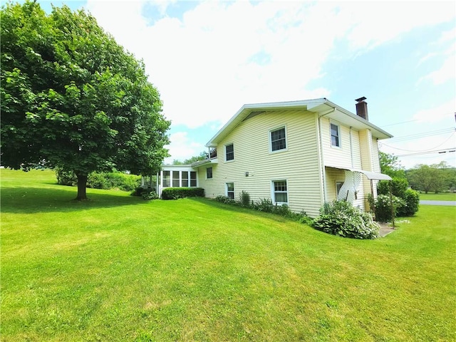 4883 Pinecrest Rd, Veteran, NY 14864 - view of property exterior with a chimney and a yard