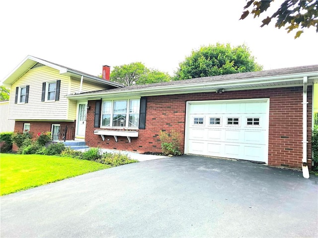 4883 Pinecrest Rd, Veteran, NY 14864 - tri-level home with brick siding, an attached garage, driveway, a chimney, and a front lawn