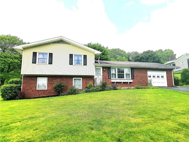 4883 Pinecrest Rd, Veteran, NY 14864 - tri-level home with a garage, driveway, brick siding, and a front lawn