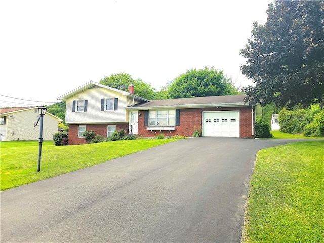 4883 Pinecrest Rd, Veteran, NY 14864 - split level home featuring a garage, driveway, a front lawn, and brick siding