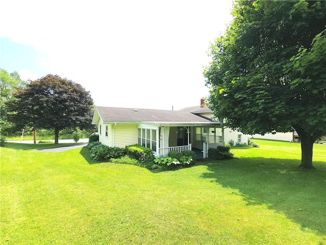 4883 Pinecrest Rd, Veteran, NY 14864 - view of property exterior featuring a porch, a yard, and a chimney