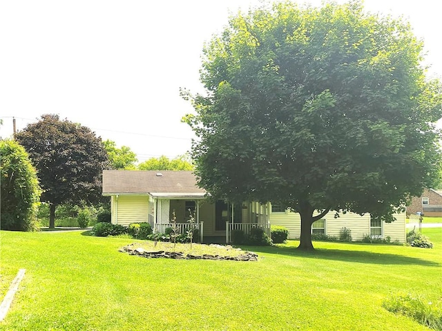 4883 Pinecrest Rd, Veteran, NY 14864 - view of green lawn featuring covered porch