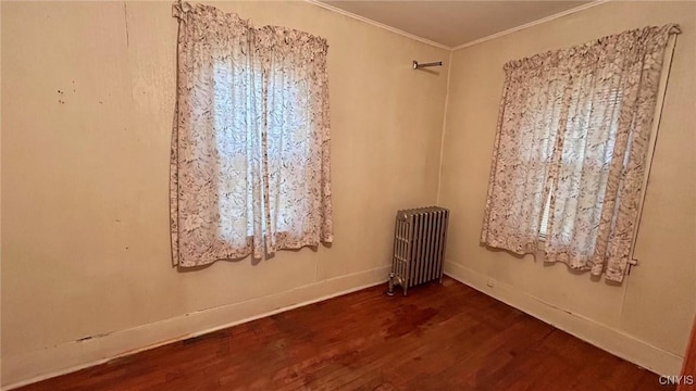 318 Boyden St, Syracuse, NY 13203 - spare room featuring radiator, wood finished floors, and ornamental molding