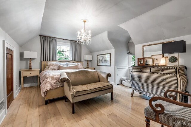 87 Garrison Rd, Amherst, NY 14221 - bedroom featuring lofted ceiling, a chandelier, and light wood finished floors