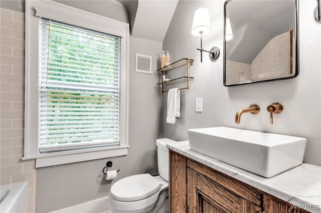 87 Garrison Rd, Amherst, NY 14221 - bathroom featuring healthy amount of natural light, a bathtub, vanity, lofted ceiling, and a shower