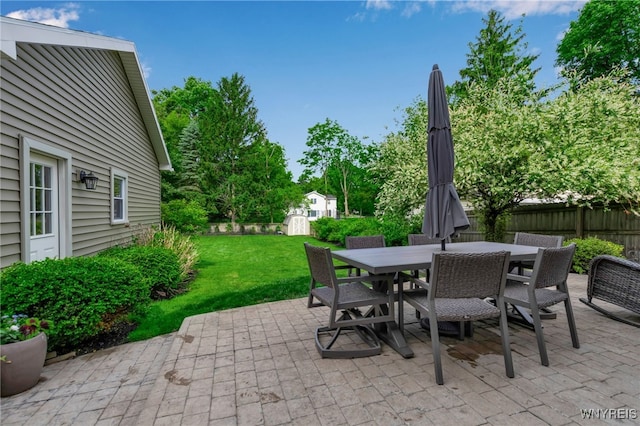 87 Garrison Rd, Amherst, NY 14221 - fenced backyard featuring a shed, a patio, and outdoor dining area