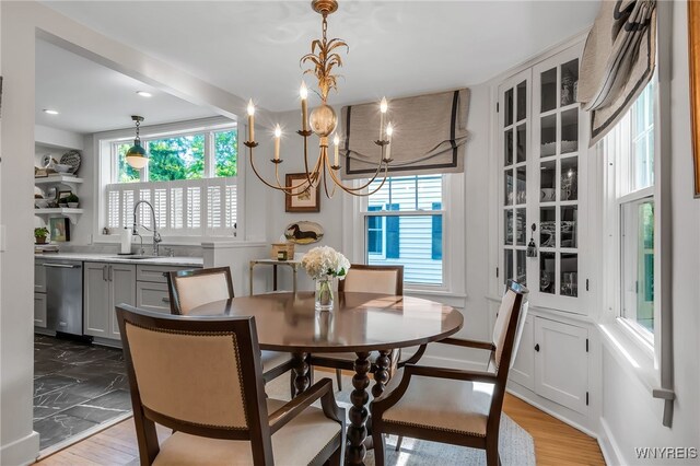 87 Garrison Rd, Amherst, NY 14221 - dining area featuring a chandelier, light wood-type flooring, and recessed lighting