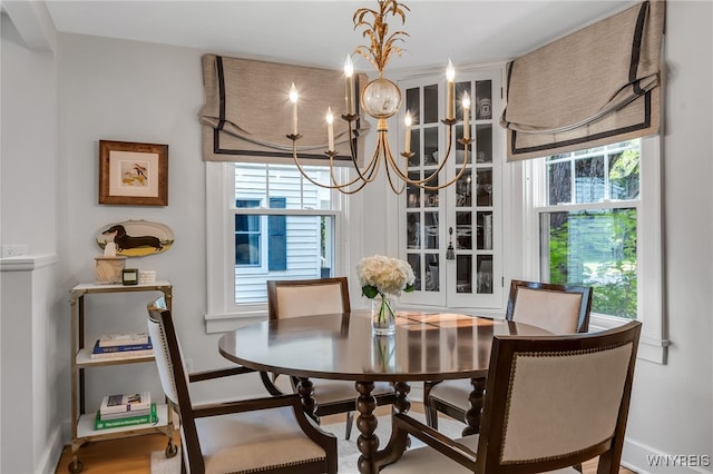 87 Garrison Rd, Amherst, NY 14221 - dining space featuring healthy amount of natural light and a chandelier
