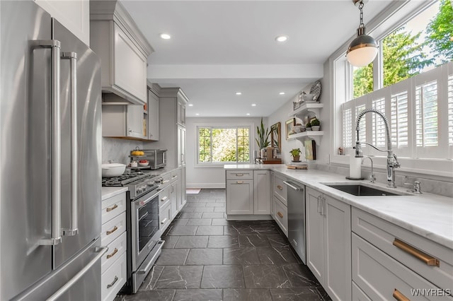 87 Garrison Rd, Amherst, NY 14221 - kitchen with high end appliances, recessed lighting, a peninsula, pendant lighting, and open shelves
