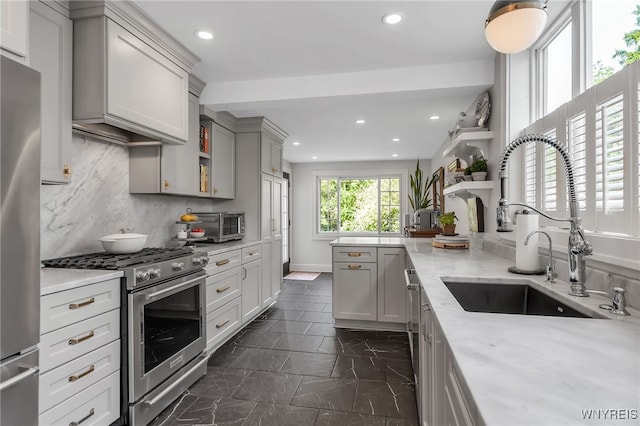 87 Garrison Rd, Amherst, NY 14221 - kitchen featuring appliances with stainless steel finishes, open shelves, gray cabinets, recessed lighting, and tasteful backsplash
