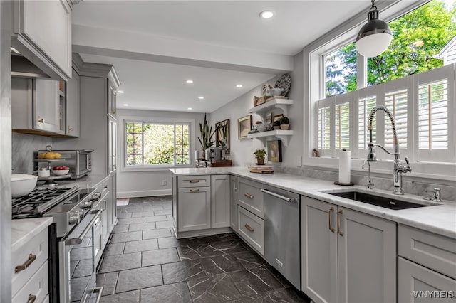 87 Garrison Rd, Amherst, NY 14221 - kitchen featuring stainless steel appliances, gray cabinetry, dark marble finish floors, a peninsula, and recessed lighting