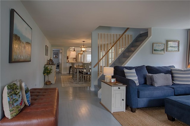 7689 State Highway 80, Springfield, NY 13468 - living room with a chandelier and stairs