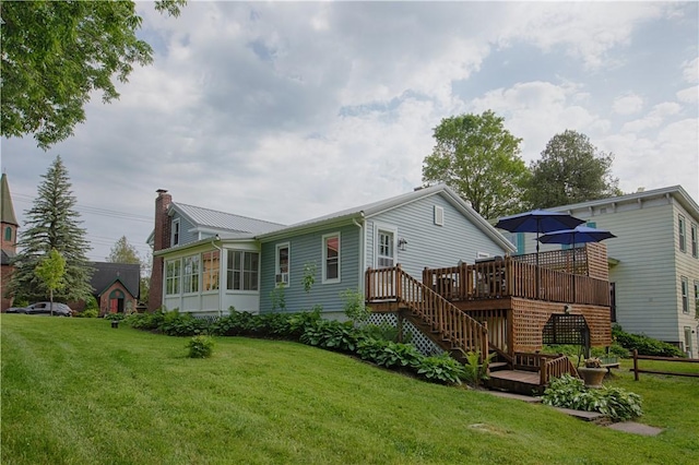 7689 State Highway 80, Springfield, NY 13468 - rear view of house with a deck, stairway, a yard, a chimney, and a metal roof