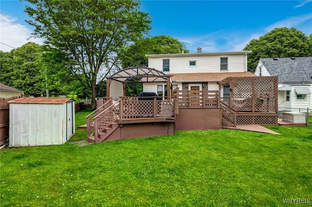 3317 D St, Niagara Falls, NY 14303 - back of property with stairway, a gazebo, a shed, and a wooden deck