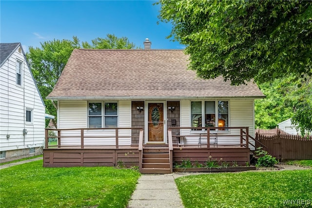 3317 D St, Niagara Falls, NY 14303 - view of front of home featuring a porch, roof with shingles, and a chimney