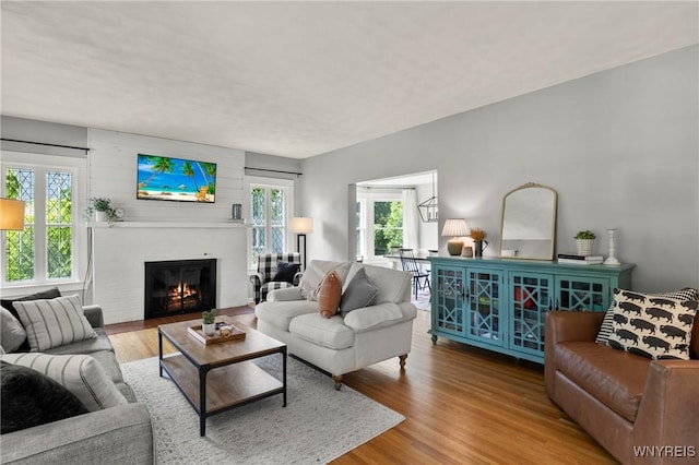 552 Locust St, Lockport-City, NY 14094 - living area with a glass covered fireplace and wood finished floors