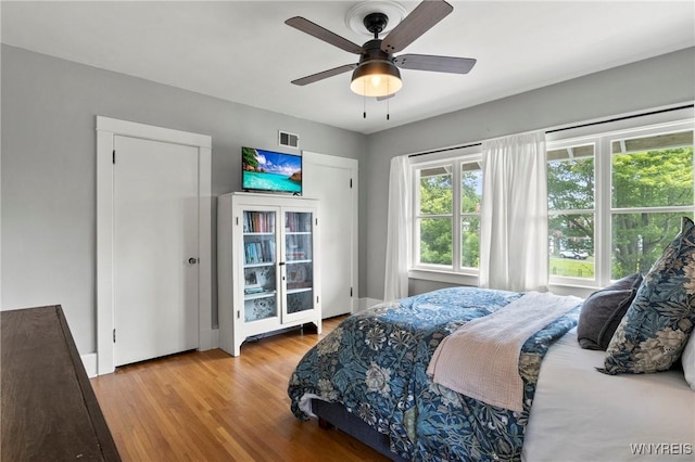 552 Locust St, Lockport-City, NY 14094 - bedroom with wood finished floors and a ceiling fan