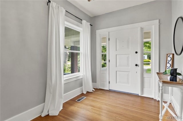 552 Locust St, Lockport-City, NY 14094 - foyer entrance featuring plenty of natural light and light wood finished floors